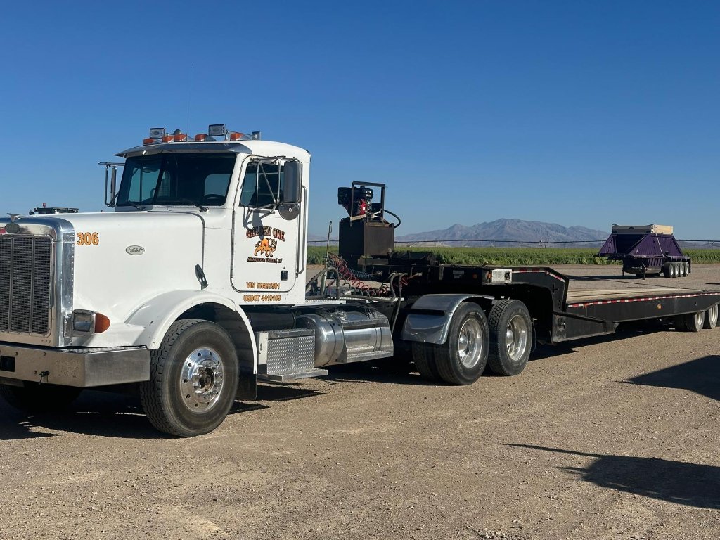 Golden One LLC heavy hauling dump truck at construction site in Nevada